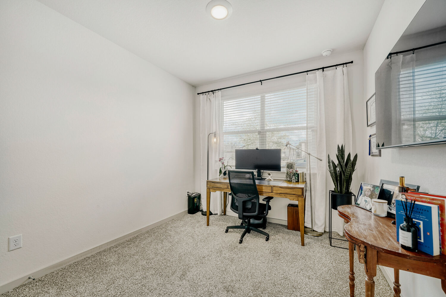 2308 Ranier Court Austin, TX 78754 - Photo 11 of 29 Office area with light colored carpet and baseboards