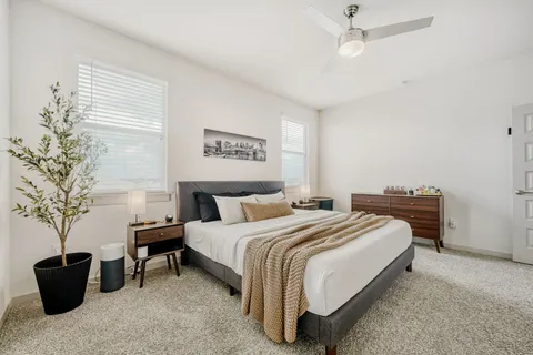 a kitchen with stainless steel appliances kitchen island granite countertop a refrigerator and a stove top oven