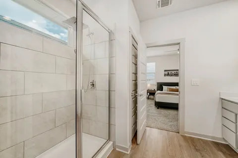 a bedroom with a bed and a mirror