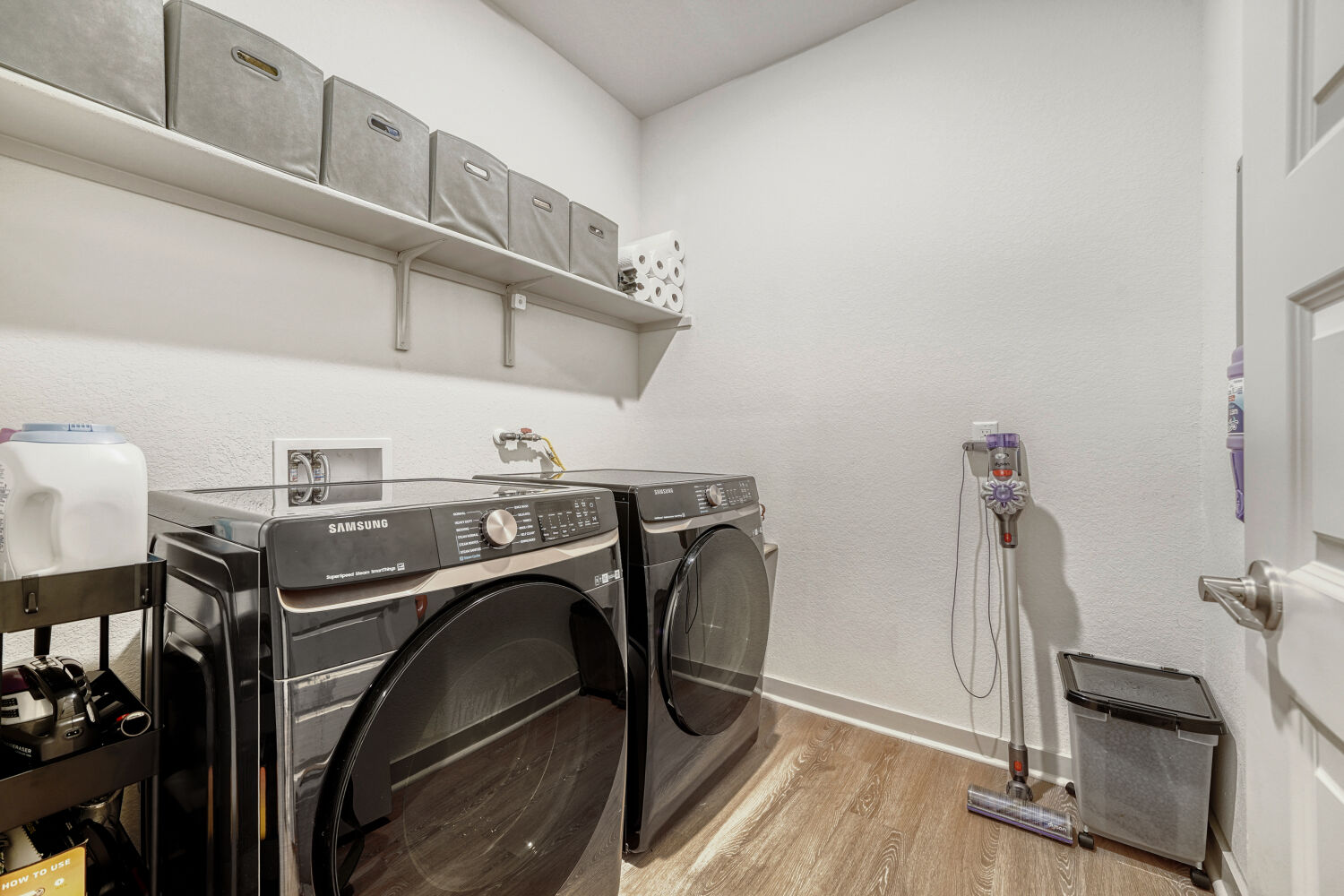 2308 Ranier Court Austin, TX 78754 - Photo 22 of 29 Laundry area featuring light wood-style flooring and independent washer and dryer
