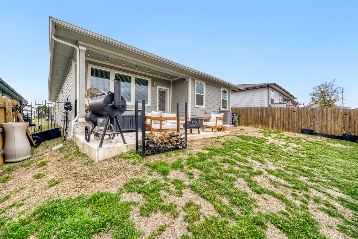 2308 Ranier Court Austin, TX 78754 - Photo 24 of 29 Rear view of house featuring a fenced backyard and a patio area