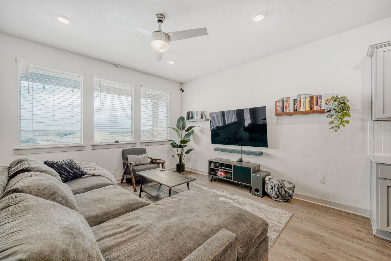 2308 Ranier Court Austin, TX 78754 - Photo 4 of 29 Living room with light wood-style floors, ceiling fan, and recessed lighting