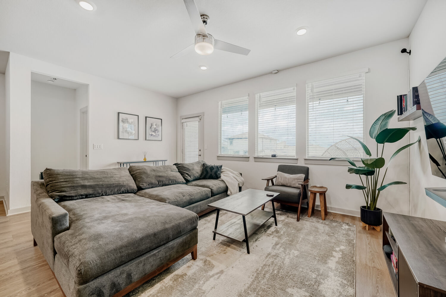 2308 Ranier Court Austin, TX 78754 - Photo 5 of 29 Living room with a ceiling fan, light wood finished floors, and recessed lighting