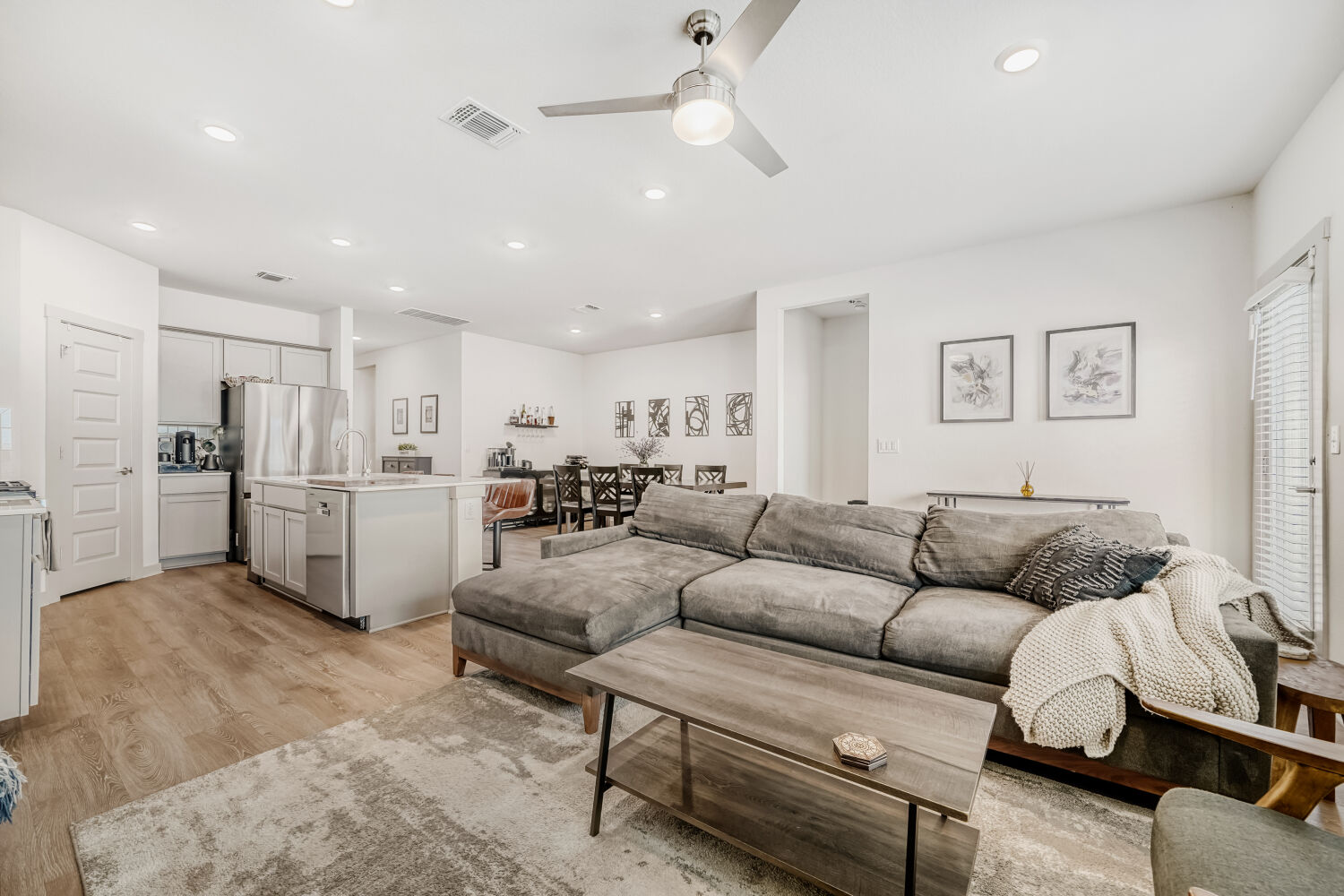 2308 Ranier Court Austin, TX 78754 - Photo 7 of 29 Living room with light wood finished floors, ceiling fan, and recessed lighting