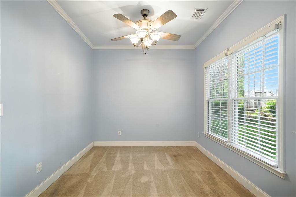 6745 Fairfield Trace Suwanee, GA 30024 - Photo 18 of 37 a view of an empty room with a window