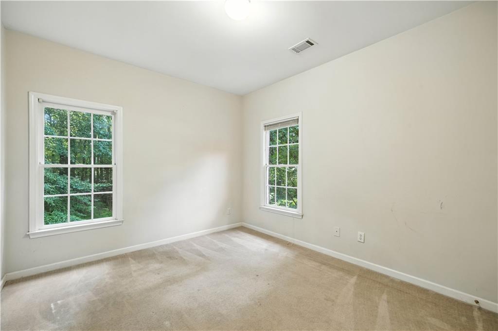 6745 Fairfield Trace Suwanee, GA 30024 - Photo 21 of 37 an empty room with a window