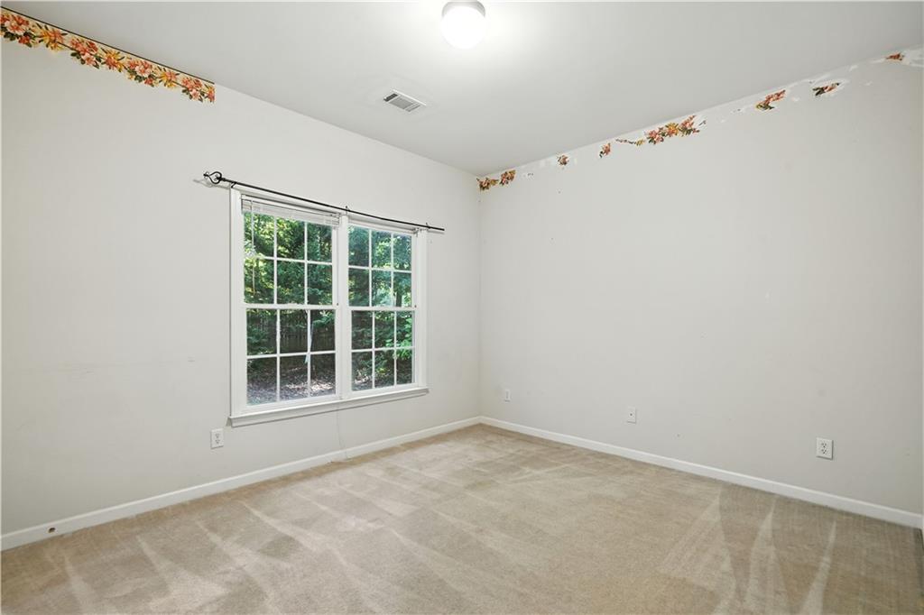 6745 Fairfield Trace Suwanee, GA 30024 - Photo 24 of 37 an empty room with a window