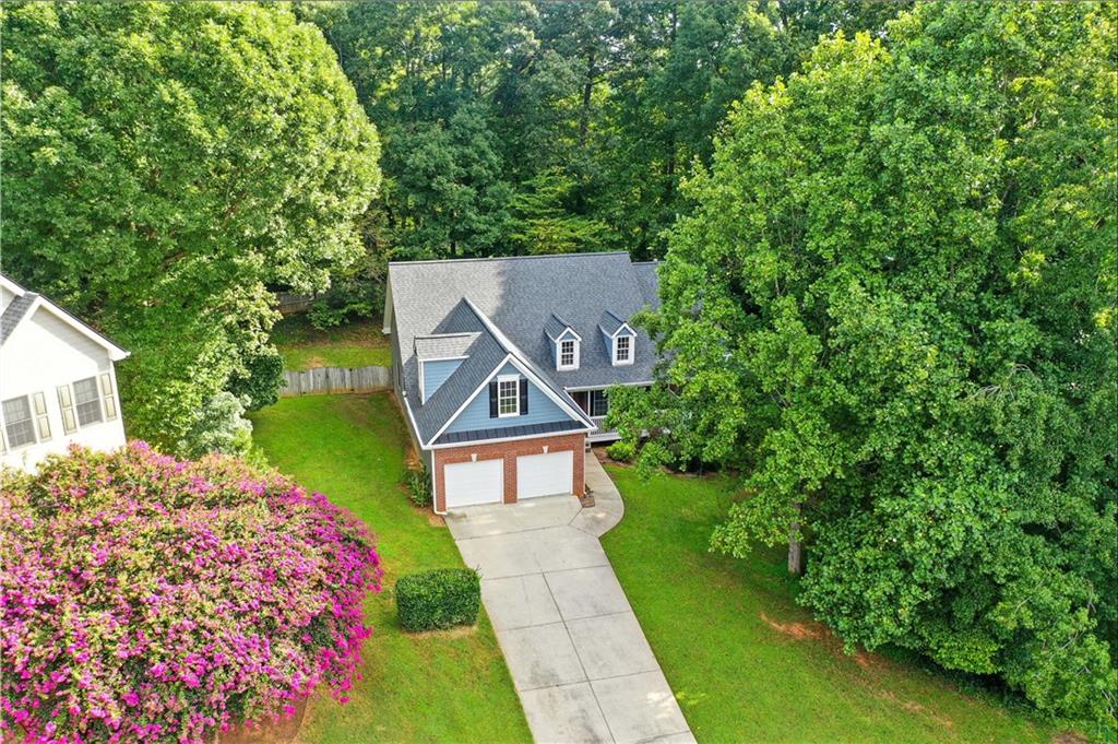 6745 Fairfield Trace Suwanee, GA 30024 - Photo 34 of 37 a pathway of a house with a yard