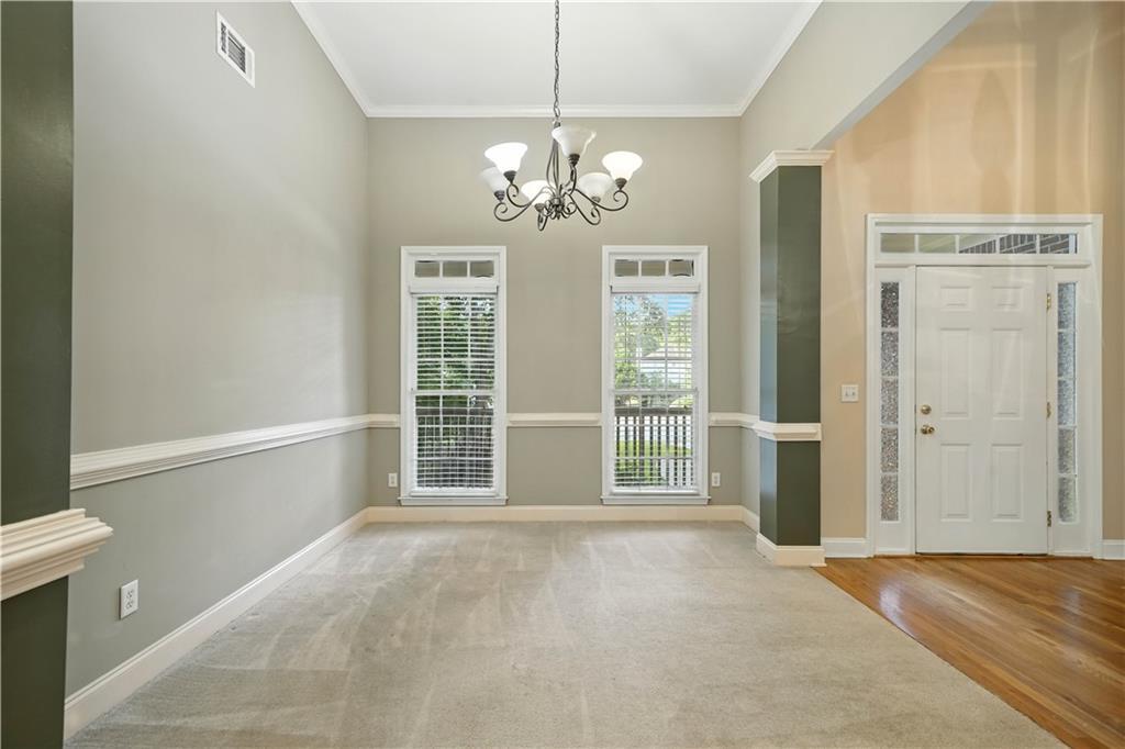 6745 Fairfield Trace Suwanee, GA 30024 - Photo 5 of 37 a view of an empty room with a window