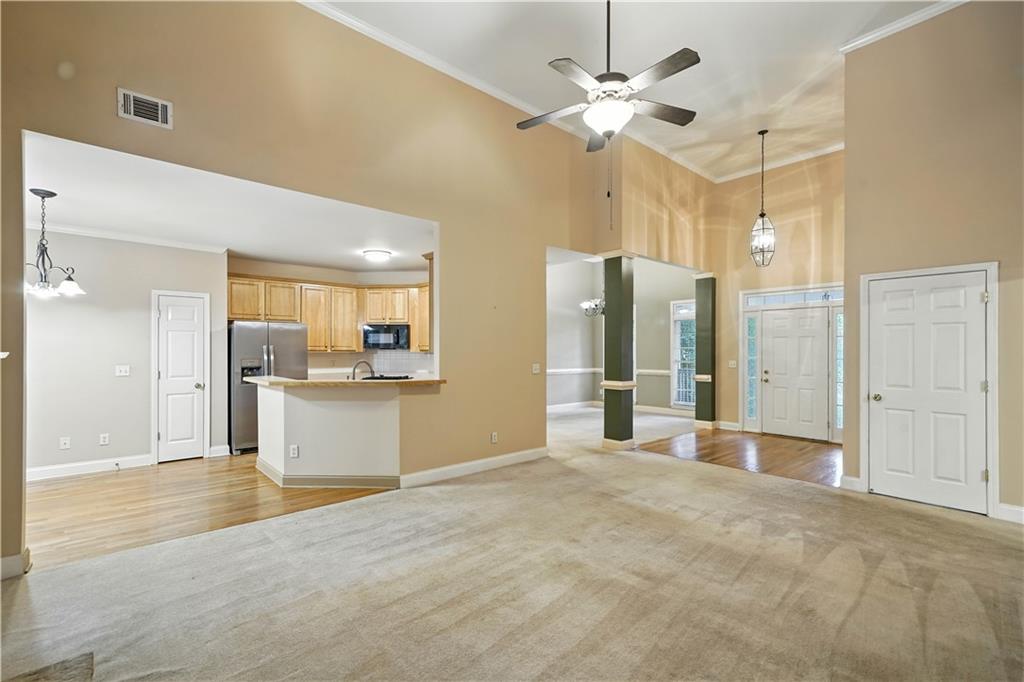 6745 Fairfield Trace Suwanee, GA 30024 - Photo 10 of 37 a view of a kitchen with a sink and a refrigerator
