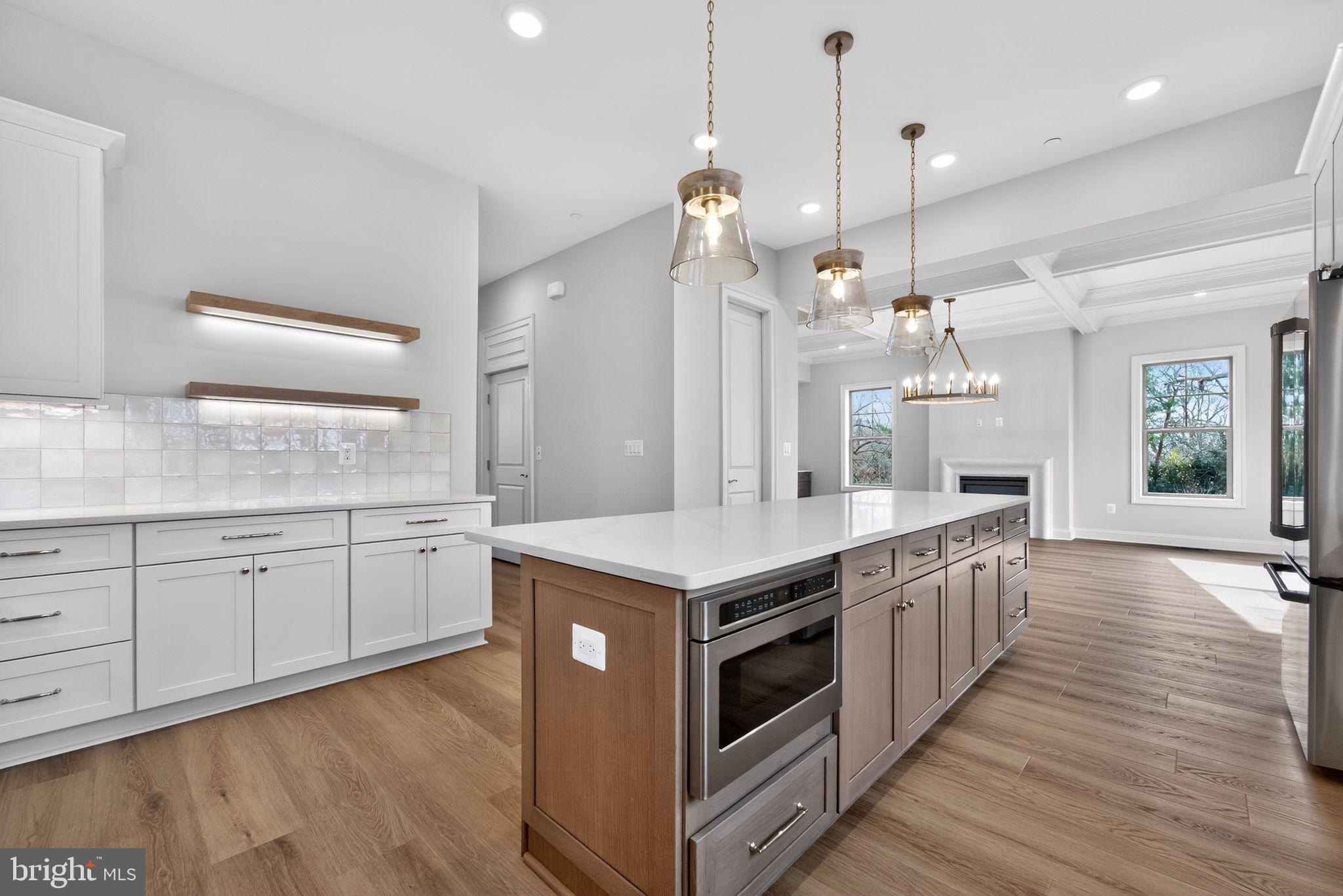 626 A Old County Road Severna Park, MD 21146 - Photo 12 of 52 a kitchen with stainless steel appliances granite countertop a stove and a wooden floors