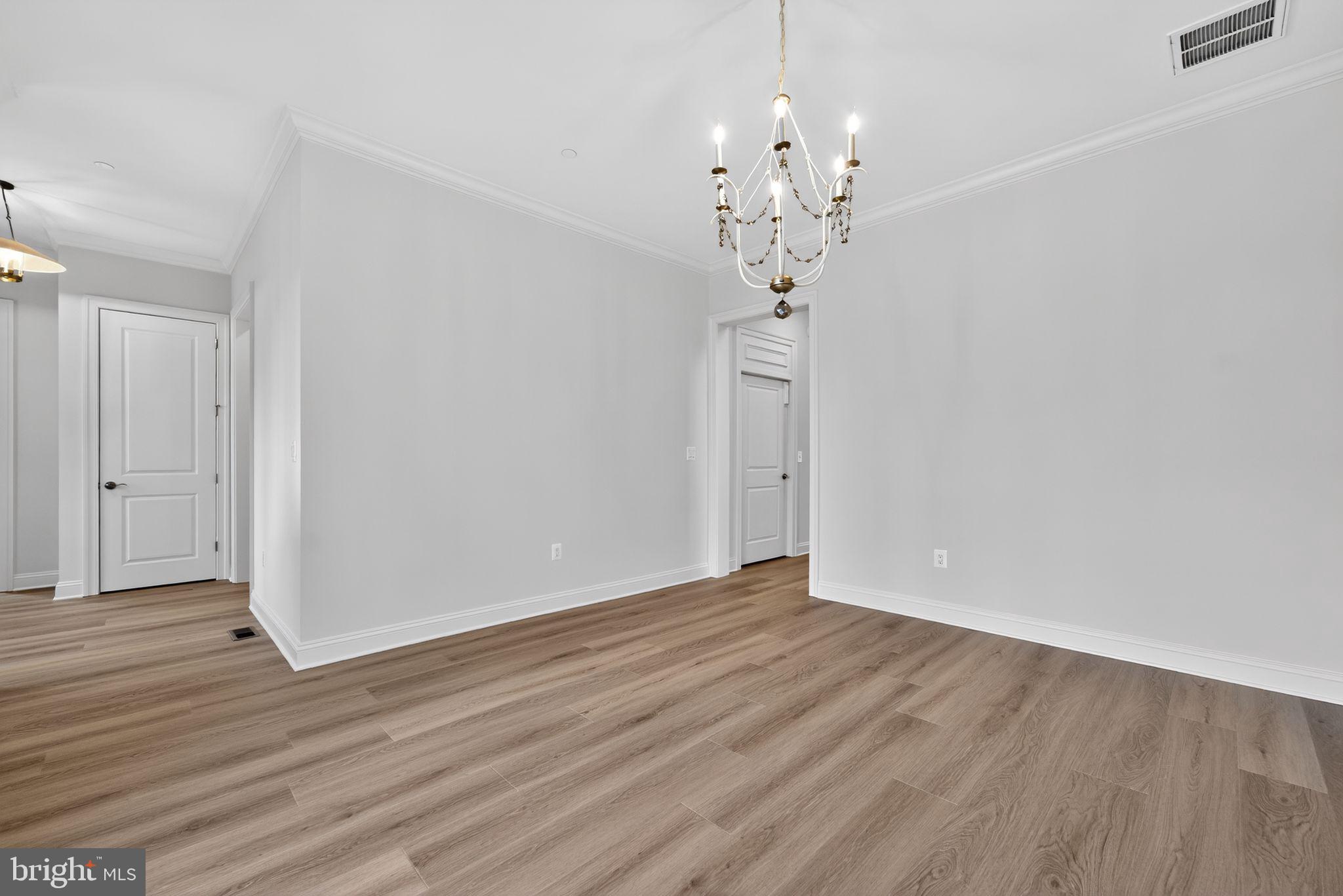 626 A Old County Road Severna Park, MD 21146 - Photo 13 of 52 a view of an empty room with wooden floor