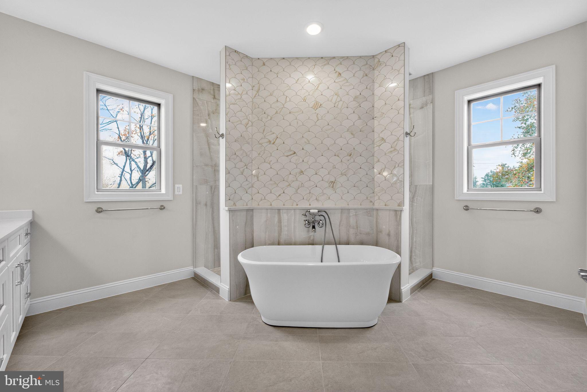 626 A Old County Road Severna Park, MD 21146 - Photo 21 of 52 a bathroom with a bathtub and window