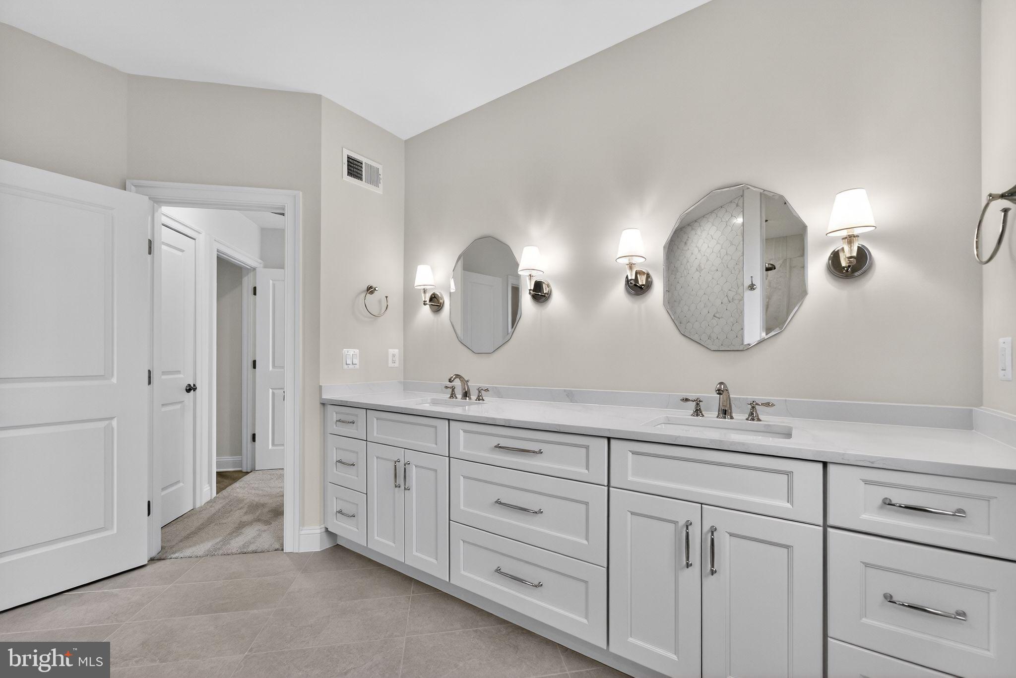 626 A Old County Road Severna Park, MD 21146 - Photo 23 of 52 a bathroom with double vanity sinks and a mirror