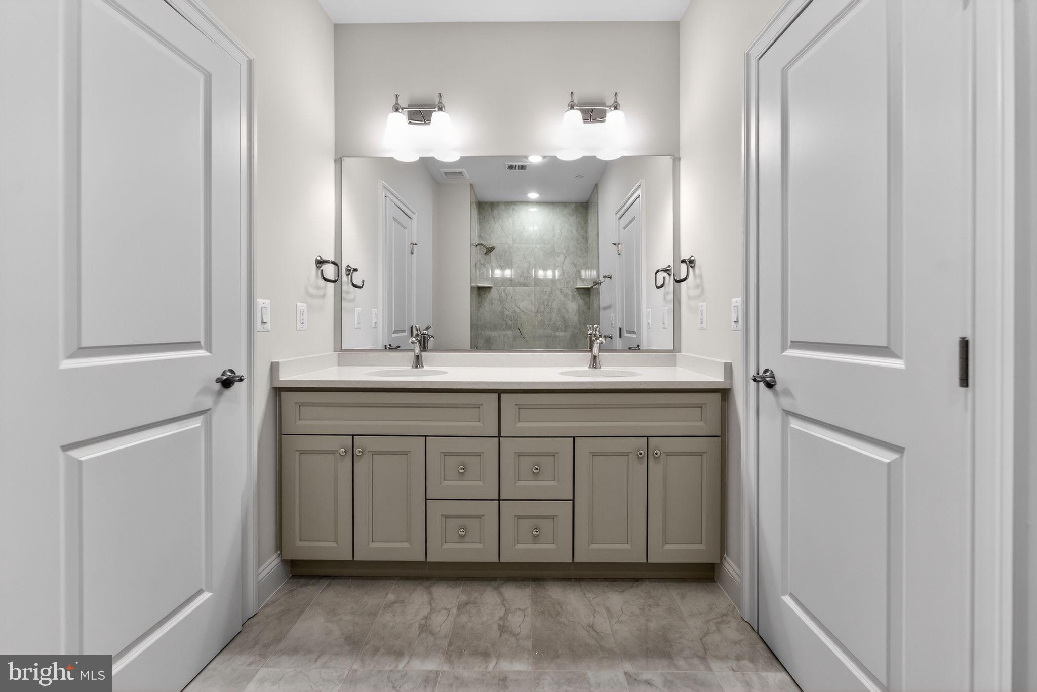 626 A Old County Road Severna Park, MD 21146 - Photo 28 of 52 a bathroom with a double vanity sink and a mirror