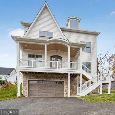 a front view of a house with a garage