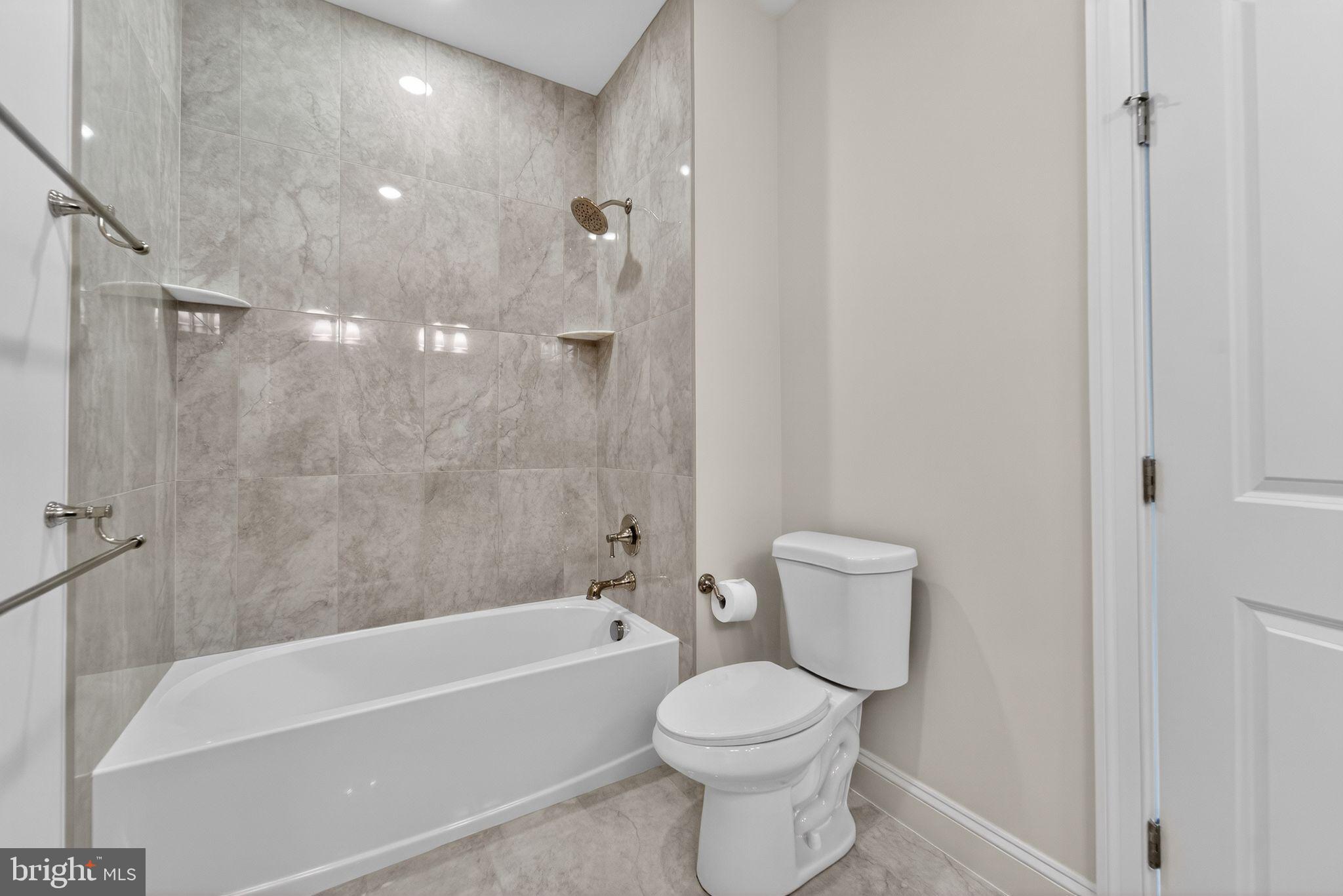 626 A Old County Road Severna Park, MD 21146 - Photo 32 of 52 a bathroom with a toilet and a bathtub