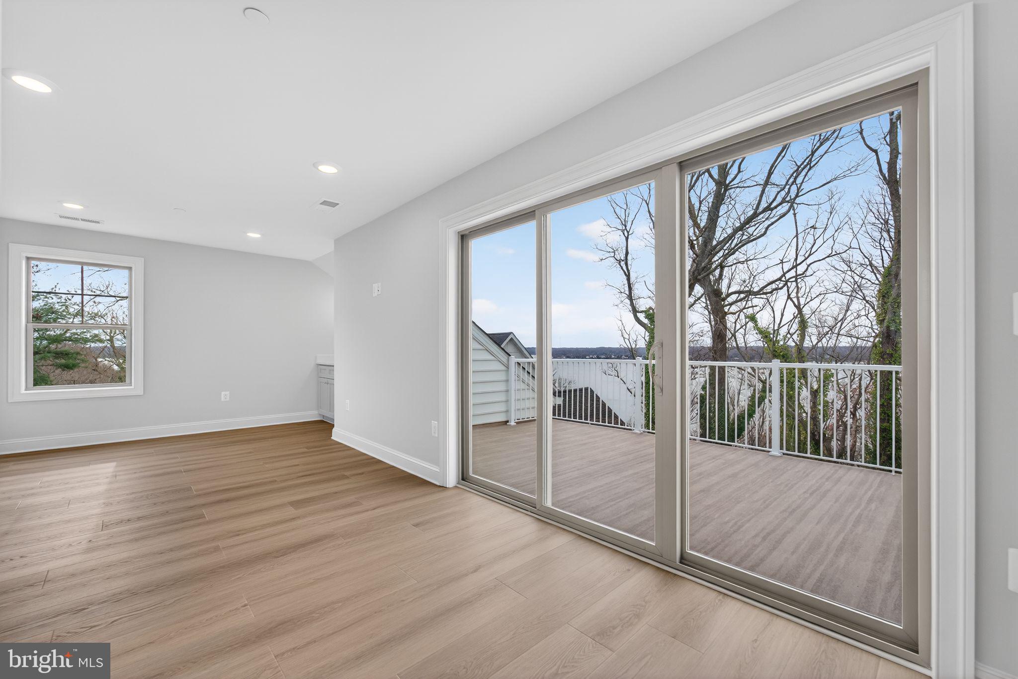 626 A Old County Road Severna Park, MD 21146 - Photo 37 of 52 an empty room with wooden floor and windows