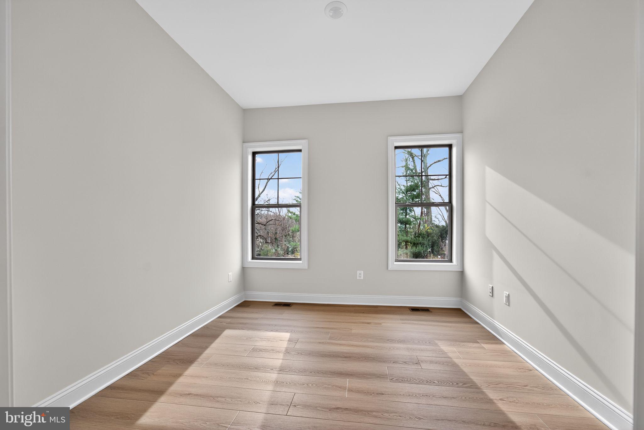 626 A Old County Road Severna Park, MD 21146 - Photo 40 of 52 an empty room with wooden floor and windows
