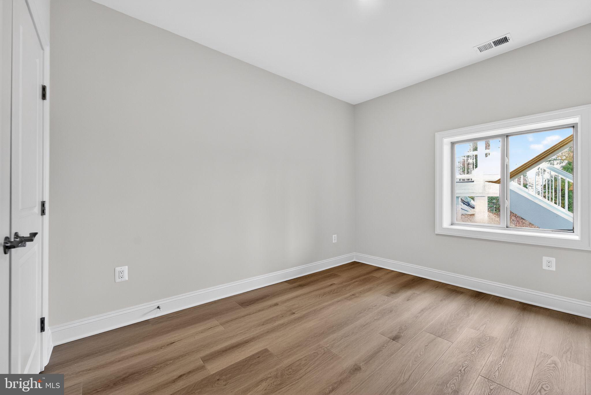 626 A Old County Road Severna Park, MD 21146 - Photo 46 of 52 an empty room with wooden floor and windows