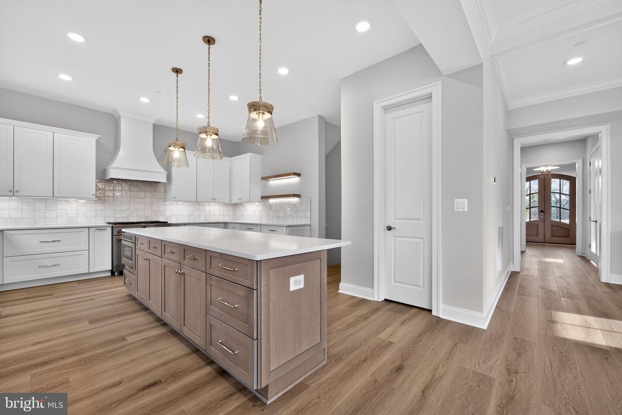 626 A Old County Road Severna Park, MD 21146 - Photo 10 of 52 a kitchen with kitchen island a counter top space a sink stainless steel appliances and cabinets