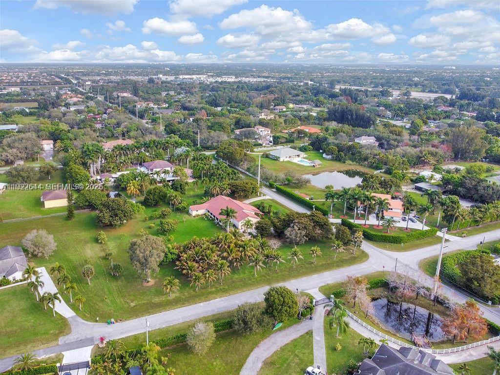 5425 Southwest 190th Avenue Southwest Ranches, FL 33332 - Photo 36 of 56 an aerial view of residential houses with outdoor space and lake view