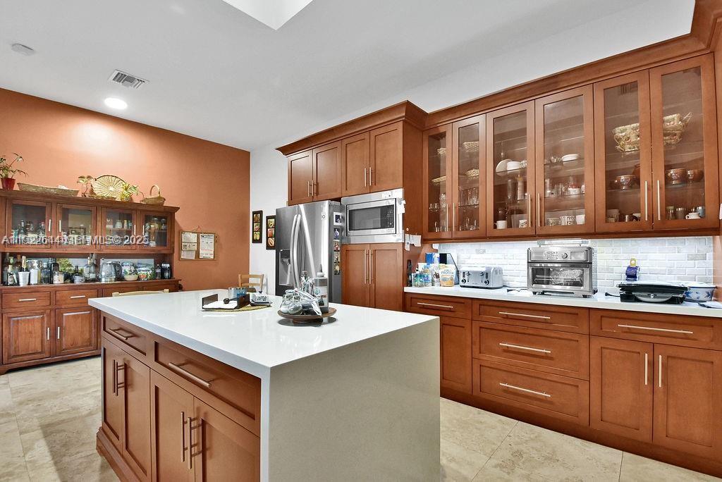 5425 Southwest 190th Avenue Southwest Ranches, FL 33332 - Photo 9 of 56 a kitchen with a stove a sink and a refrigerator