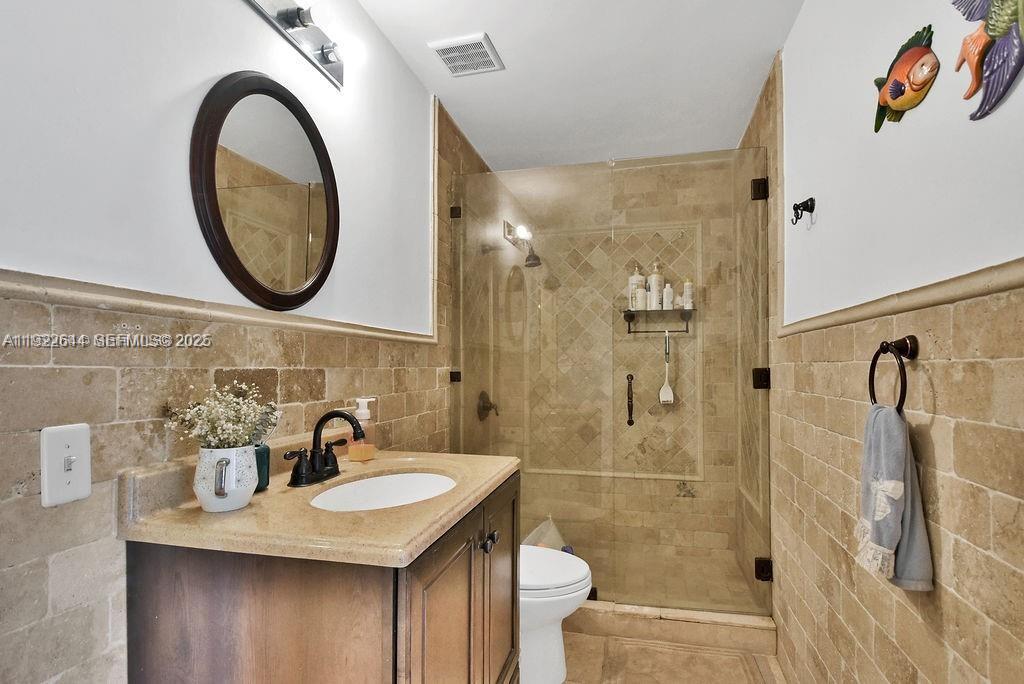 5425 Southwest 190th Avenue Southwest Ranches, FL 33332 - Photo 10 of 56 a bathroom with a sink a toilet and shower