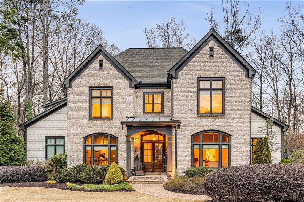 5030 Riverview Road Northwest Atlanta, GA 30339 - Photo 1 of 1 a front view of a house with garden