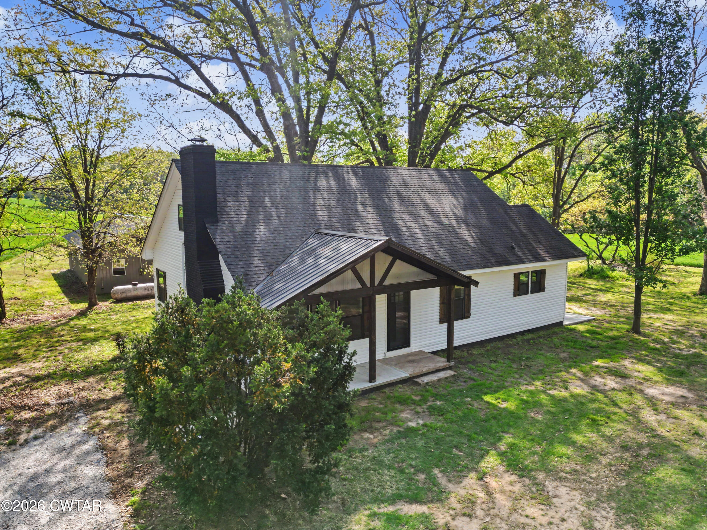 4177 Gum Flat Road Bells, TN 38006 - Photo 3 of 30 a house that has a tree in front of it