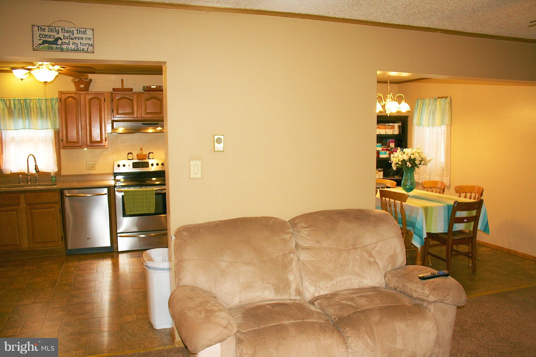 6216 Eldorado Road Rhodesdale, MD 21659 - Photo 9 of 23 Living room looking in to kitchen and dining area