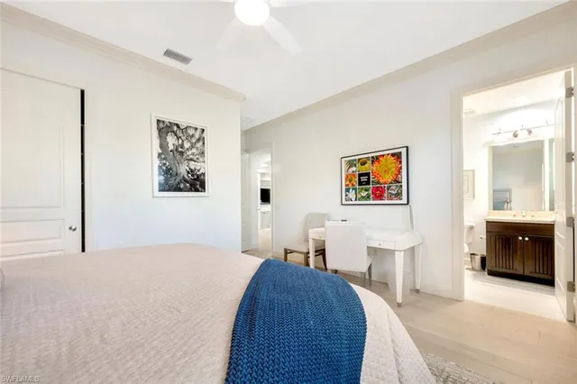 a bedroom with a bed and a walk in closet