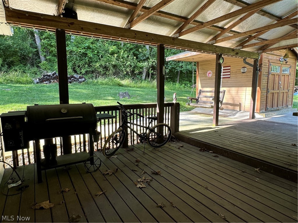 17875 Lashley Road, Unit 403 Senecaville, OH 43780 - Photo 5 of 22 Wooden terrace featuring a yard
