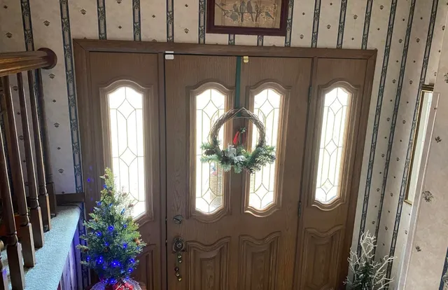 a front view of a house with wooden door