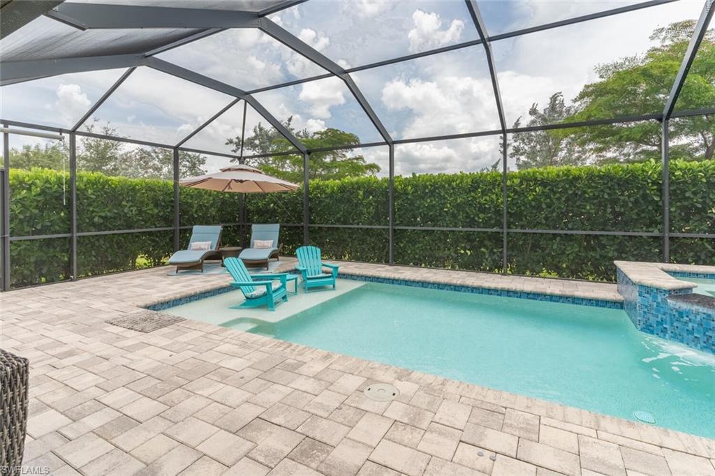 16366 Barclay Court Naples, FL 34110 - Photo 28 of 35 a view of a garden with a slide and a garden