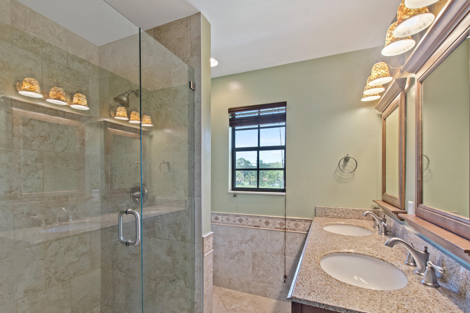 1350 C Road Loxahatchee Groves, FL 33470 - Photo 13 of 27 a bathroom with a granite countertop sink a mirror and shower