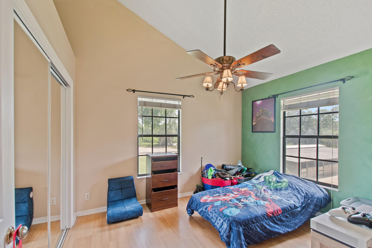 1350 C Road Loxahatchee Groves, FL 33470 - Photo 14 of 27 a bedroom with furniture and a large window