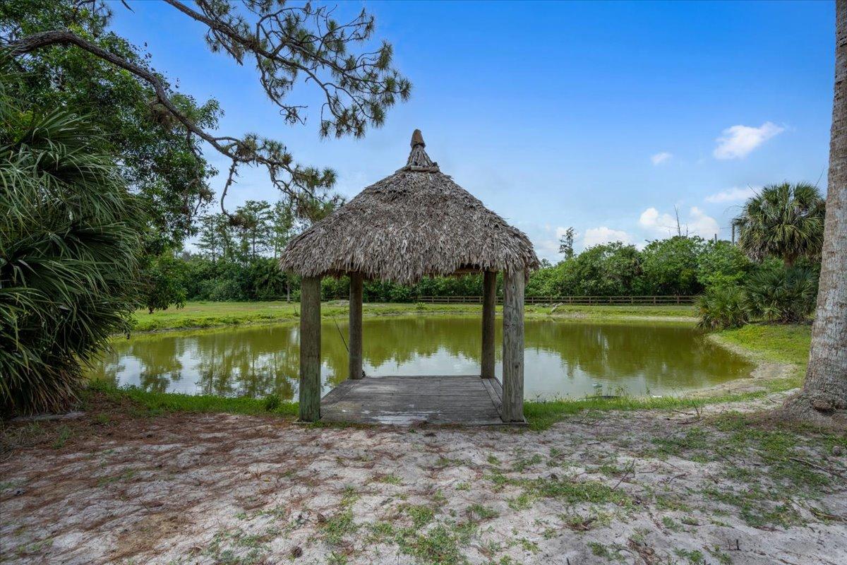 1350 C Road Loxahatchee Groves, FL 33470 - Photo 24 of 27 a backyard of a house with lots of green space