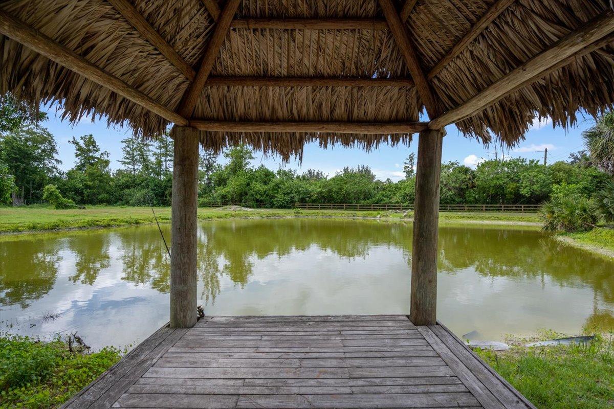 1350 C Road Loxahatchee Groves, FL 33470 - Photo 25 of 27 a view of a lake with a outdoor space