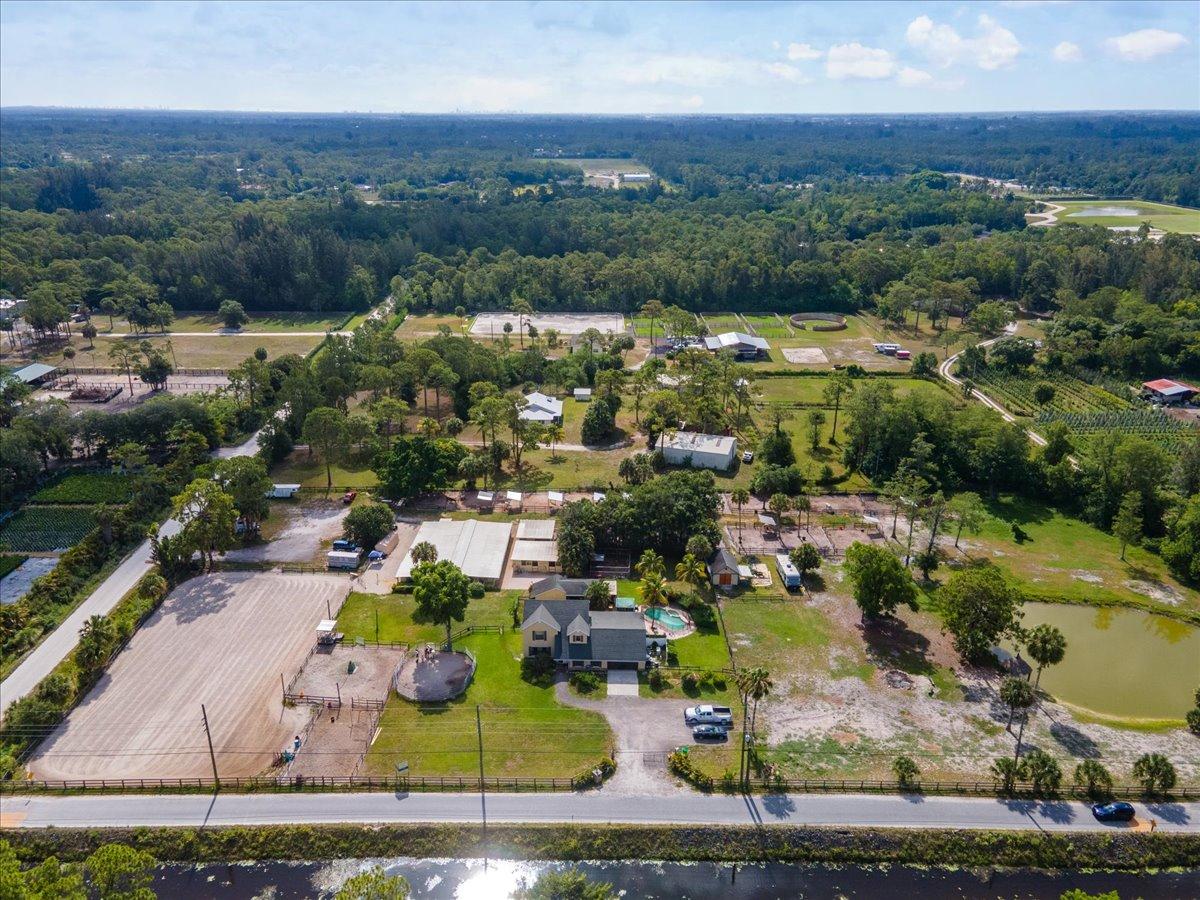 1350 C Road Loxahatchee Groves, FL 33470 - Photo 26 of 27 an aerial view of residential houses with outdoor space