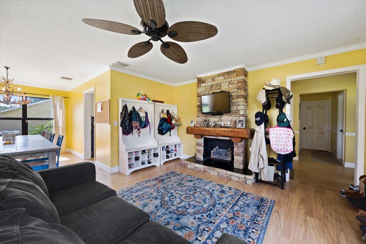 1350 C Road Loxahatchee Groves, FL 33470 - Photo 6 of 27 a living room with furniture and a fireplace