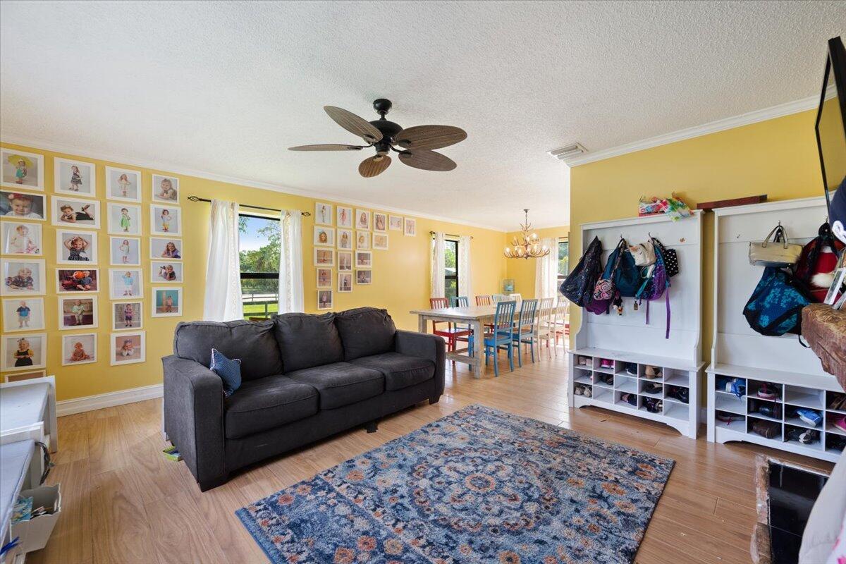 1350 C Road Loxahatchee Groves, FL 33470 - Photo 7 of 27 a living room with furniture and a rug
