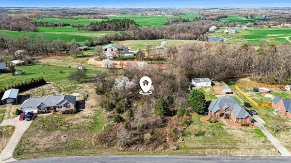 an aerial view of a house with garden