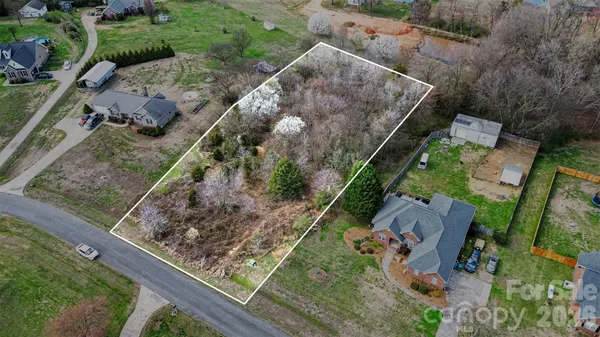 an aerial view of residential house with outdoor space