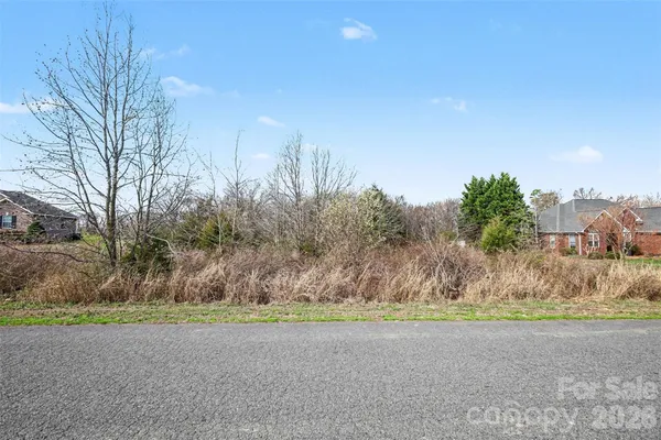 an aerial view of multiple houses with yard