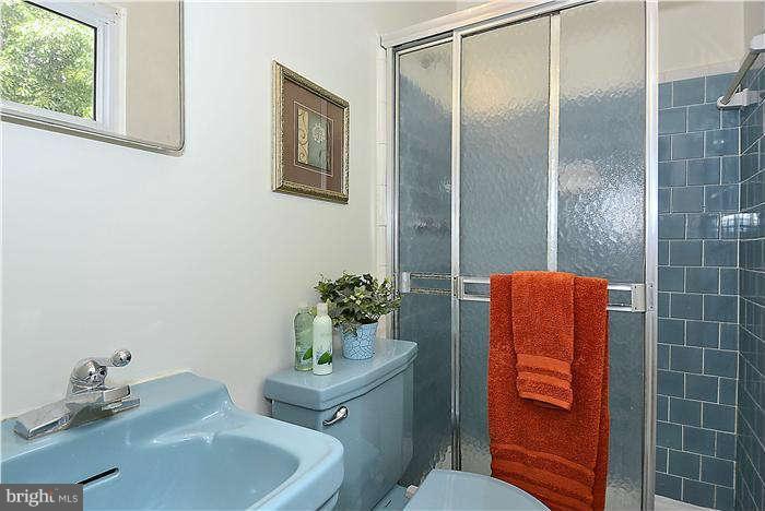 305 Irwin Street Silver Spring, MD 20901 - Photo 12 of 23 a bathroom with a sink toilet and shower
