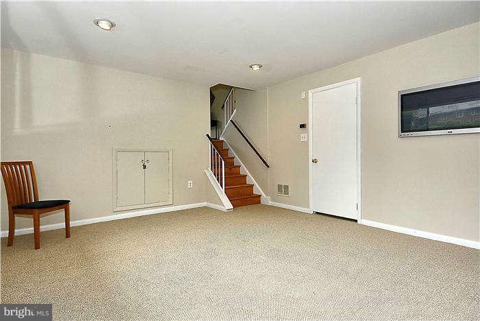 305 Irwin Street Silver Spring, MD 20901 - Photo 16 of 23 a view of an empty room with stairs