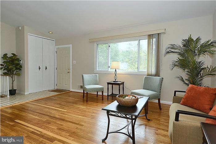 305 Irwin Street Silver Spring, MD 20901 - Photo 3 of 23 a bedroom with furniture and a potted plant