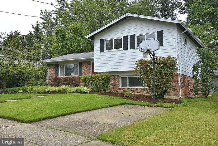 305 Irwin Street Silver Spring, MD 20901 - Photo 21 of 23 a front view of house with yard and green space