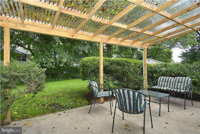 305 Irwin Street Silver Spring, MD 20901 - Photo 22 of 23 a view of a chair and tables in the patio